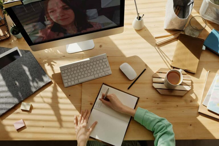 Desk with computer and notebook